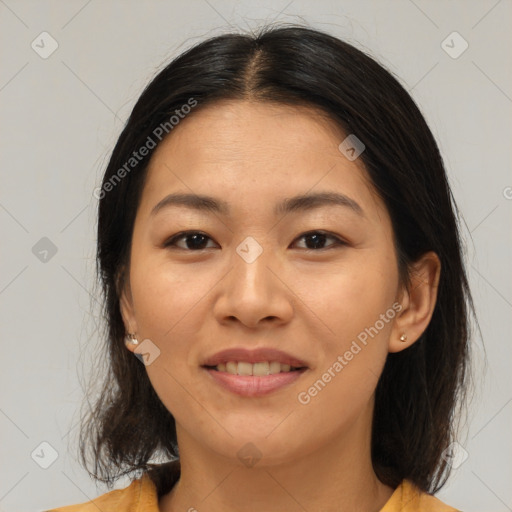 Joyful asian young-adult female with medium  brown hair and brown eyes