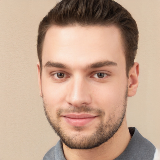 Joyful white young-adult male with short  brown hair and brown eyes