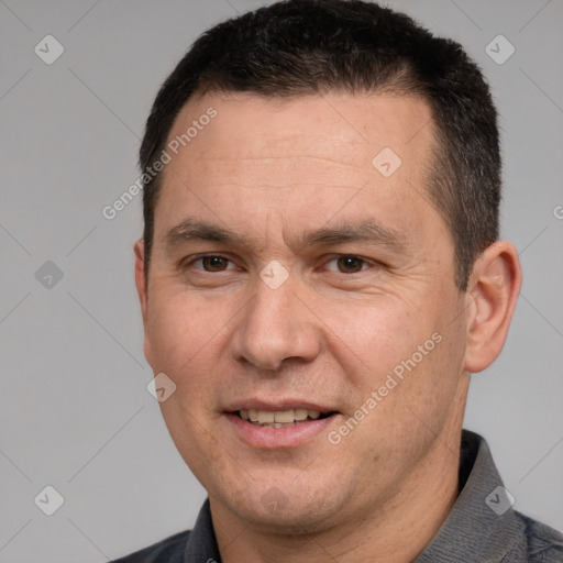 Joyful white adult male with short  brown hair and brown eyes