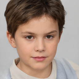 Joyful white child male with short  brown hair and brown eyes