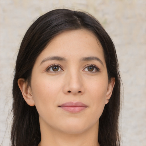 Joyful asian young-adult female with long  brown hair and brown eyes
