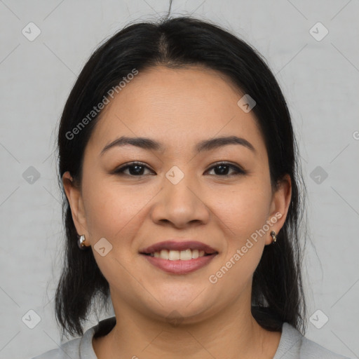 Joyful asian young-adult female with medium  black hair and brown eyes