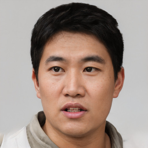 Neutral asian young-adult male with short  black hair and brown eyes