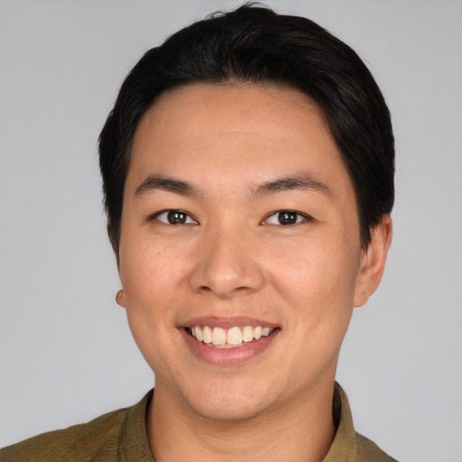 Joyful asian young-adult male with short  brown hair and brown eyes