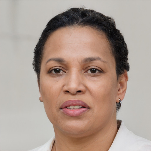 Joyful black adult female with short  brown hair and brown eyes