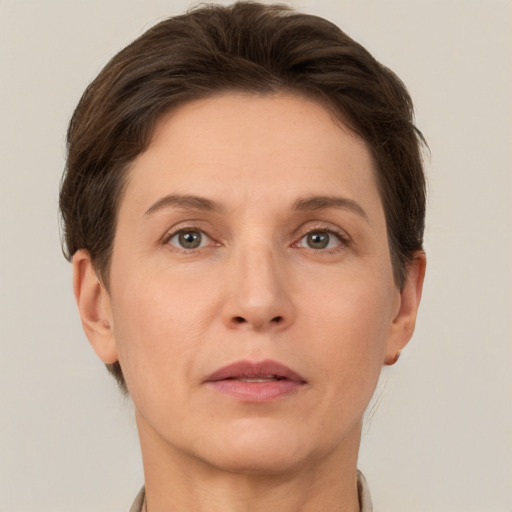 Neutral white adult female with short  brown hair and grey eyes