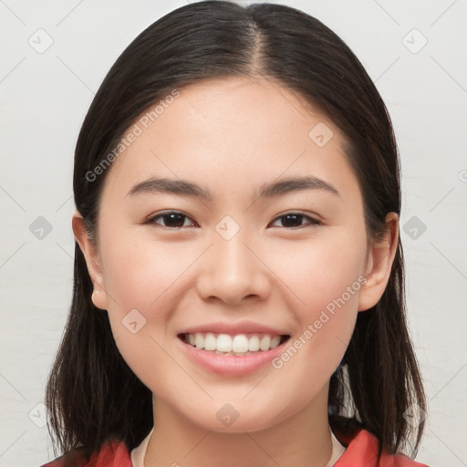 Joyful white young-adult female with long  brown hair and brown eyes