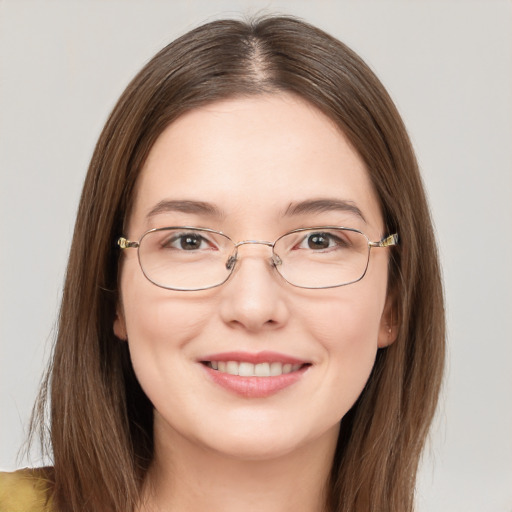 Joyful white young-adult female with long  brown hair and green eyes