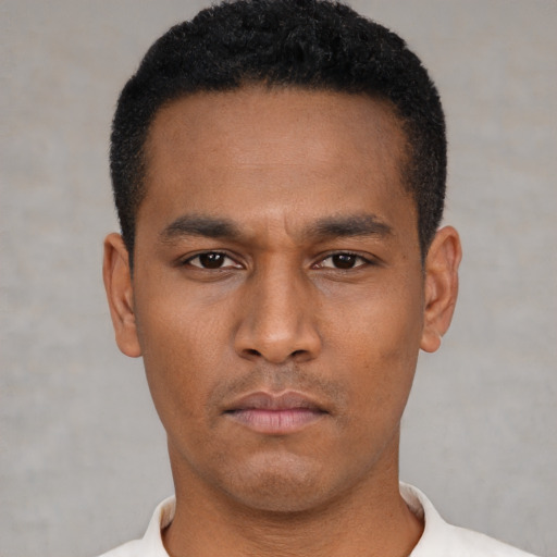 Neutral latino young-adult male with short  black hair and brown eyes
