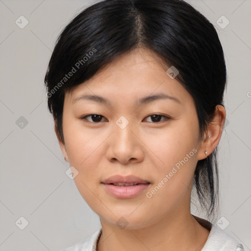 Joyful asian young-adult female with medium  black hair and brown eyes