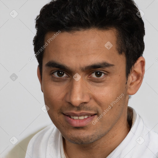 Joyful white young-adult male with short  black hair and brown eyes