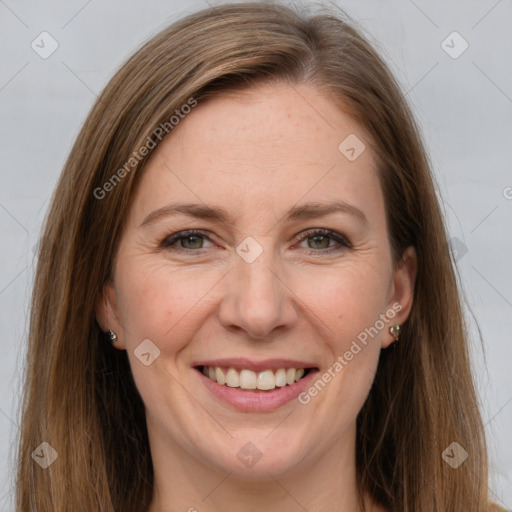 Joyful white adult female with long  brown hair and grey eyes