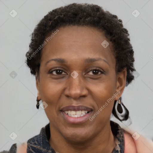 Joyful black adult female with short  brown hair and brown eyes