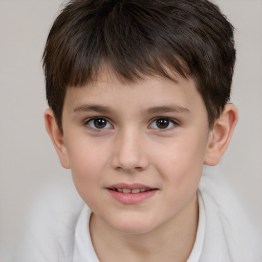 Joyful white child male with short  brown hair and brown eyes