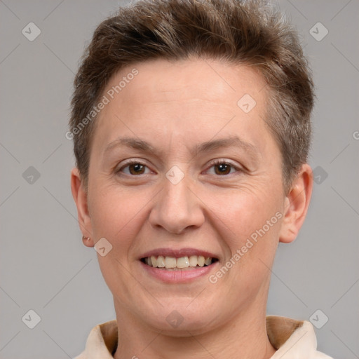 Joyful white adult female with short  brown hair and brown eyes