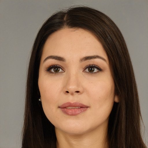 Joyful white young-adult female with long  brown hair and brown eyes