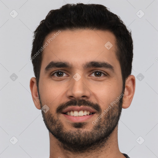 Joyful white young-adult male with short  black hair and brown eyes