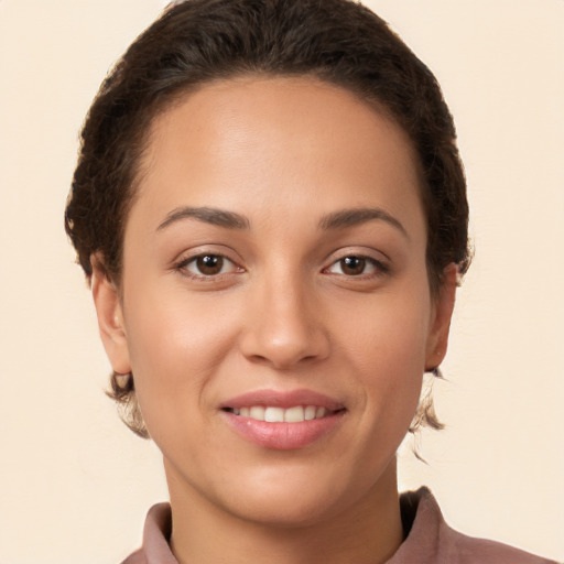 Joyful white young-adult female with short  brown hair and brown eyes