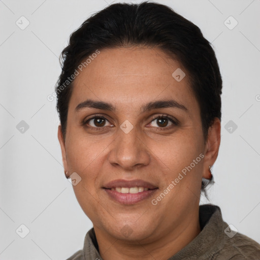 Joyful white adult female with short  brown hair and brown eyes