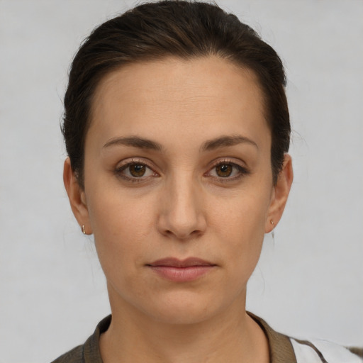 Neutral white young-adult female with short  brown hair and brown eyes