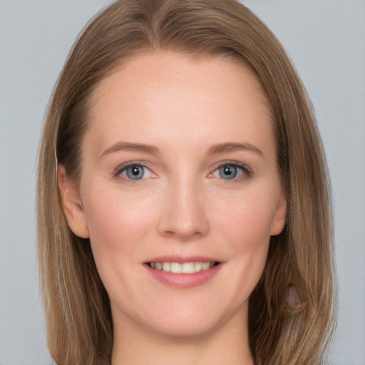 Joyful white young-adult female with long  brown hair and grey eyes