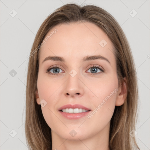 Joyful white young-adult female with long  brown hair and blue eyes