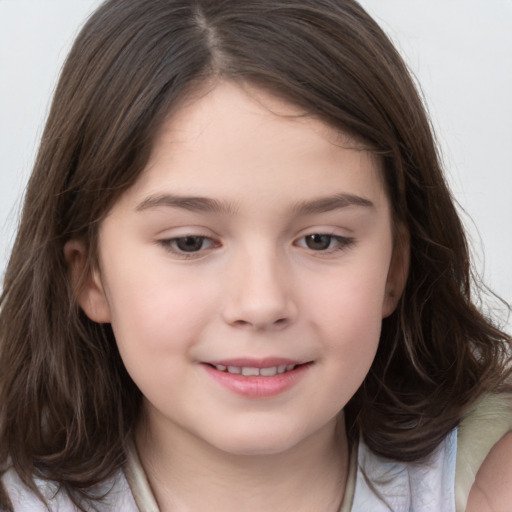 Joyful white child female with long  brown hair and brown eyes