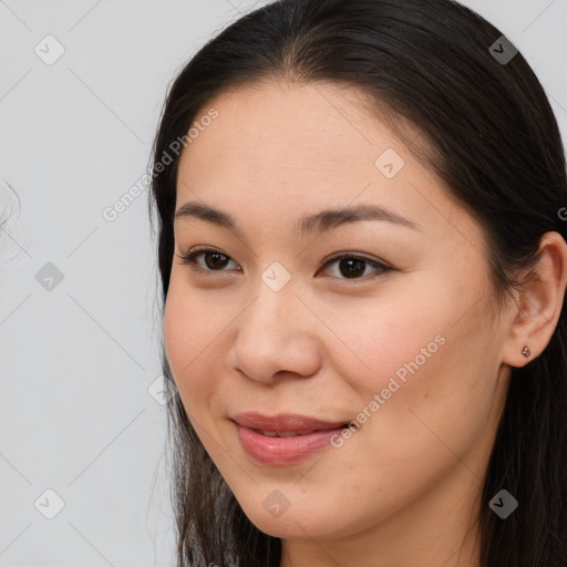 Joyful asian young-adult female with long  brown hair and brown eyes