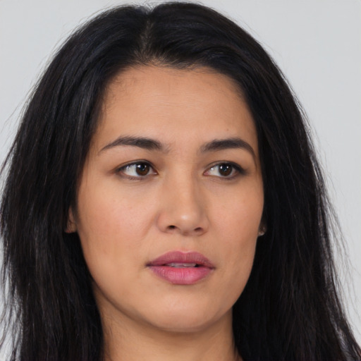 Neutral latino young-adult female with long  brown hair and brown eyes