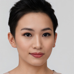 Joyful asian young-adult female with short  black hair and brown eyes