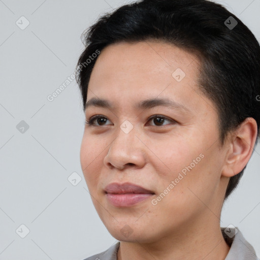 Joyful white young-adult female with short  black hair and brown eyes