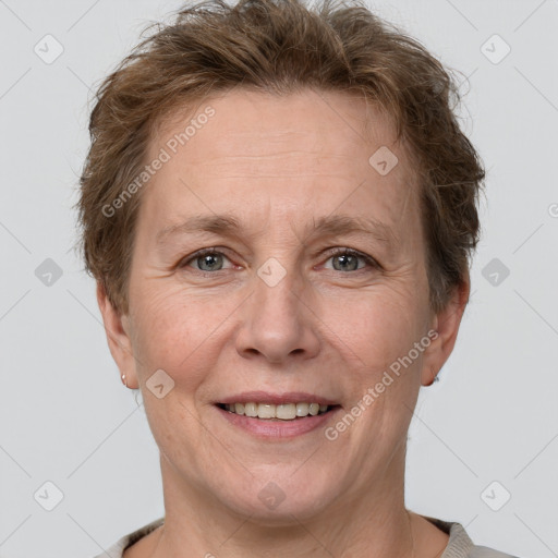 Joyful white adult female with short  brown hair and grey eyes