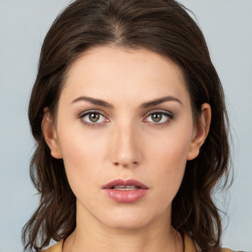 Neutral white young-adult female with medium  brown hair and brown eyes