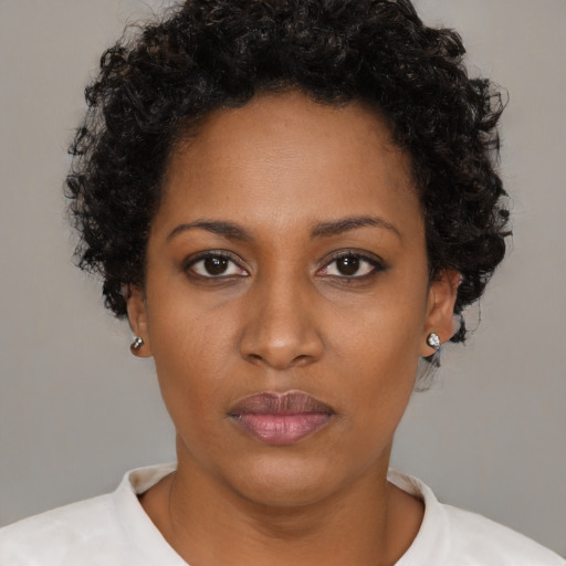 Neutral black young-adult female with short  black hair and brown eyes