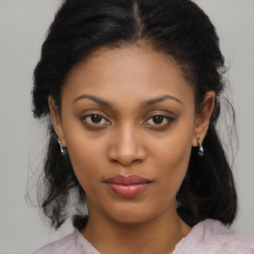 Joyful black young-adult female with medium  brown hair and brown eyes