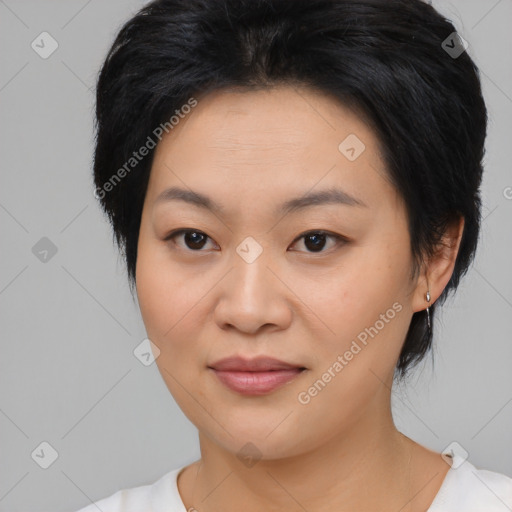 Joyful asian young-adult female with medium  black hair and brown eyes