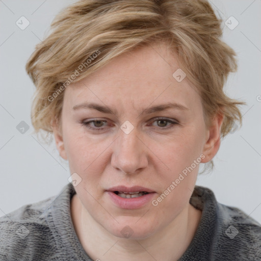 Joyful white adult female with medium  brown hair and blue eyes