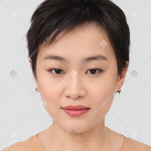 Joyful asian young-adult female with short  brown hair and brown eyes