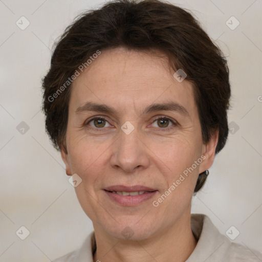 Joyful white adult female with short  brown hair and grey eyes