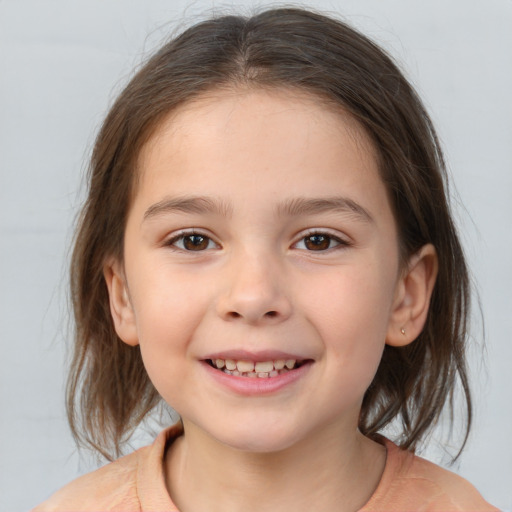 Joyful white child female with medium  brown hair and brown eyes