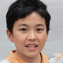 Joyful asian child female with short  brown hair and brown eyes