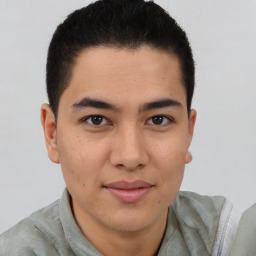 Joyful latino young-adult male with short  brown hair and brown eyes