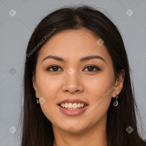 Joyful latino young-adult female with long  brown hair and brown eyes