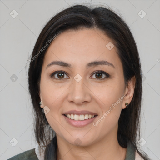 Joyful latino young-adult female with medium  brown hair and brown eyes