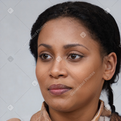 Joyful black young-adult female with medium  brown hair and brown eyes