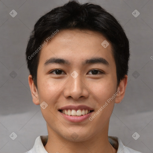 Joyful asian young-adult male with short  brown hair and brown eyes