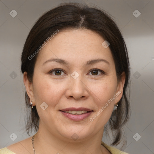 Joyful white adult female with medium  brown hair and brown eyes