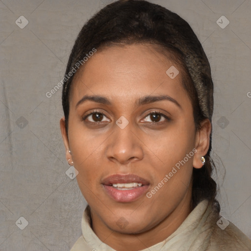 Joyful black young-adult female with short  brown hair and brown eyes