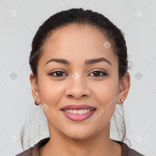 Joyful latino young-adult female with long  brown hair and brown eyes