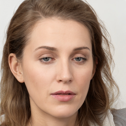 Neutral white young-adult female with long  brown hair and grey eyes